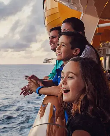 Family enjoying the ocean view from a cruise ship